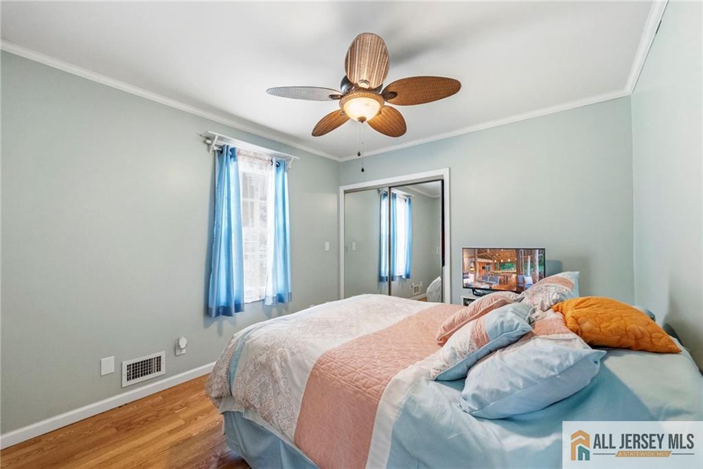 50 3rd Street Fords, NJ 08863 - Photo 13 of 36 a bedroom with a bed and window