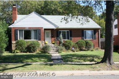 2008 Cascade Road Silver Spring, MD 20902 - Photo 1 of 1 a view of a white house with a yard potted plants and large trees