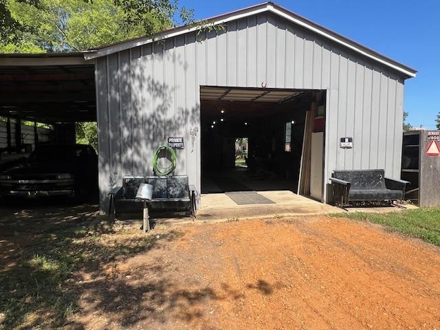 135 Angotti Road Crump, TN 38327 - Photo 22 of 29 View of outbuilding featuring a carport and a garage