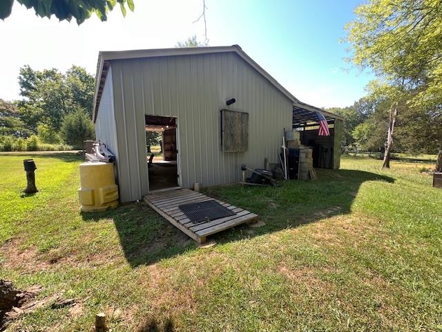 135 Angotti Road Crump, TN 38327 - Photo 23 of 29 View of outdoor structure with a yard
