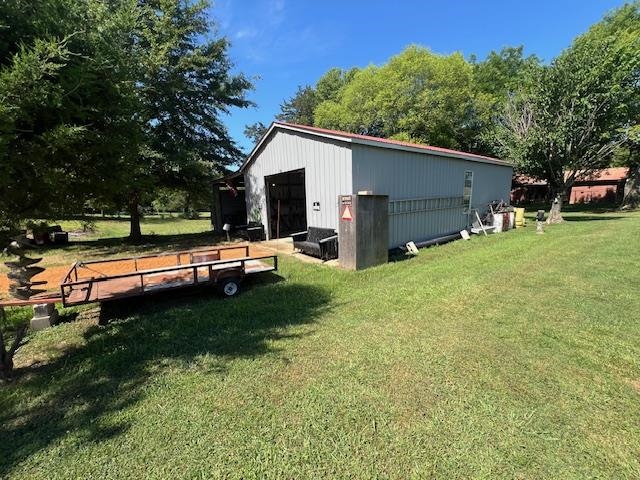 135 Angotti Road Crump, TN 38327 - Photo 24 of 29 Exterior space with a yard