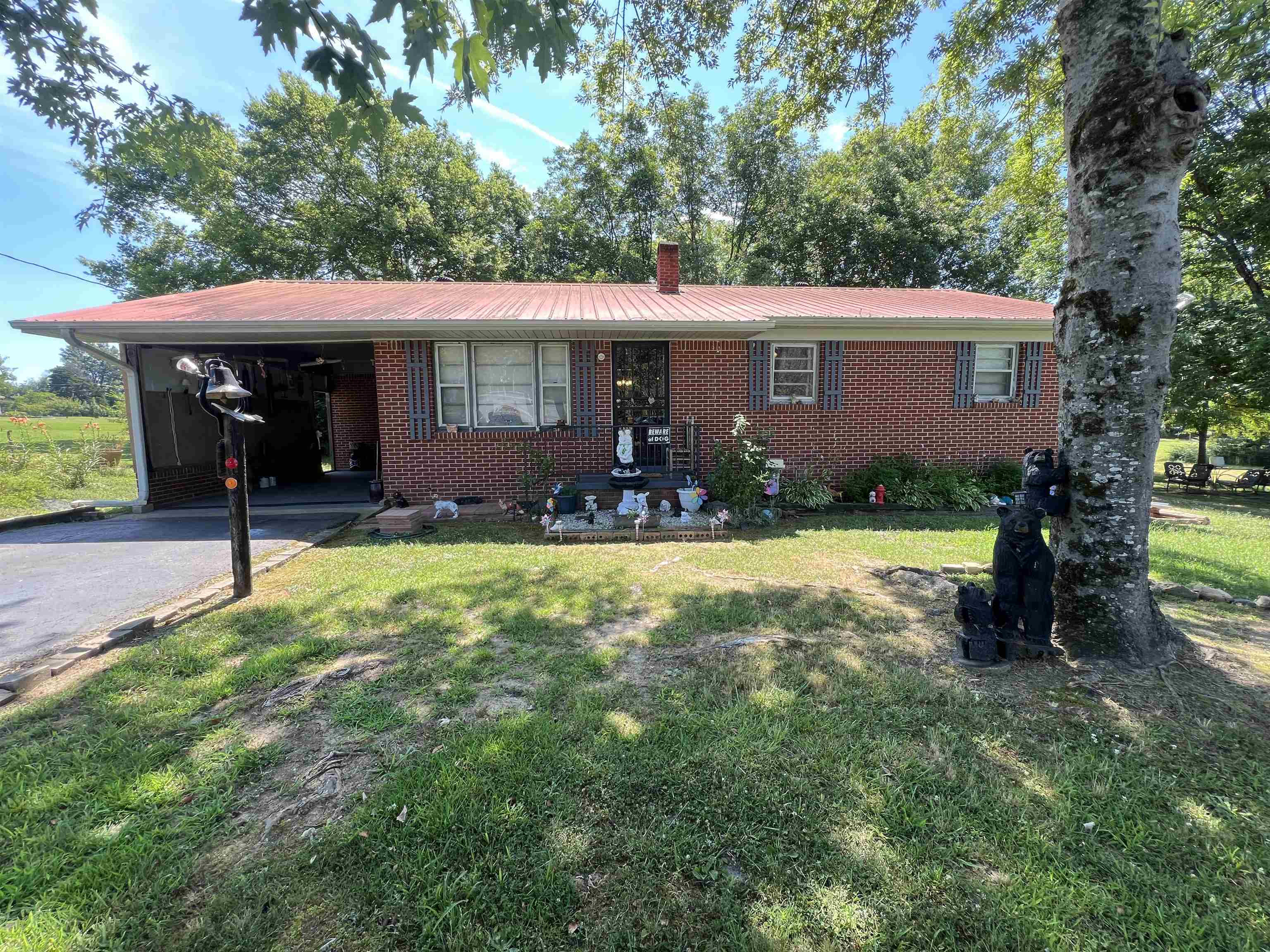 135 Angotti Road Crump, TN 38327 - Photo 26 of 29 Ranch-style house with a carport and a front lawn