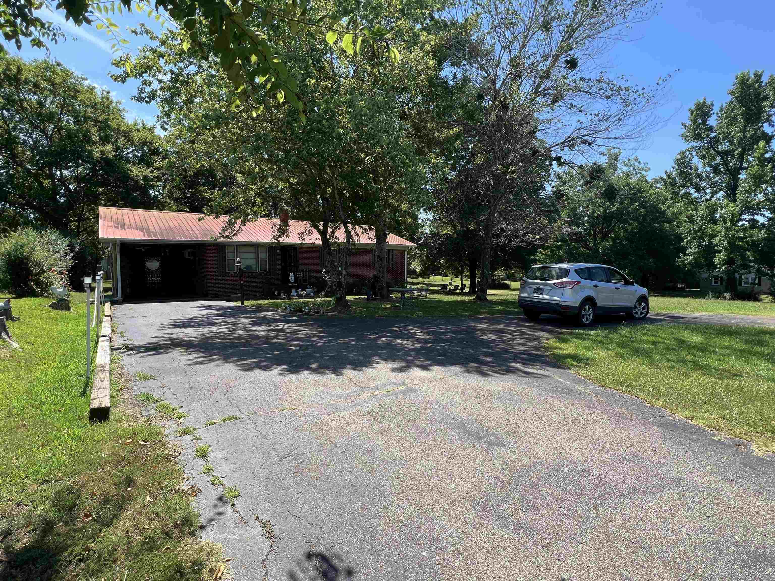 135 Angotti Road Crump, TN 38327 - Photo 27 of 29 View of front facade featuring a front lawn
