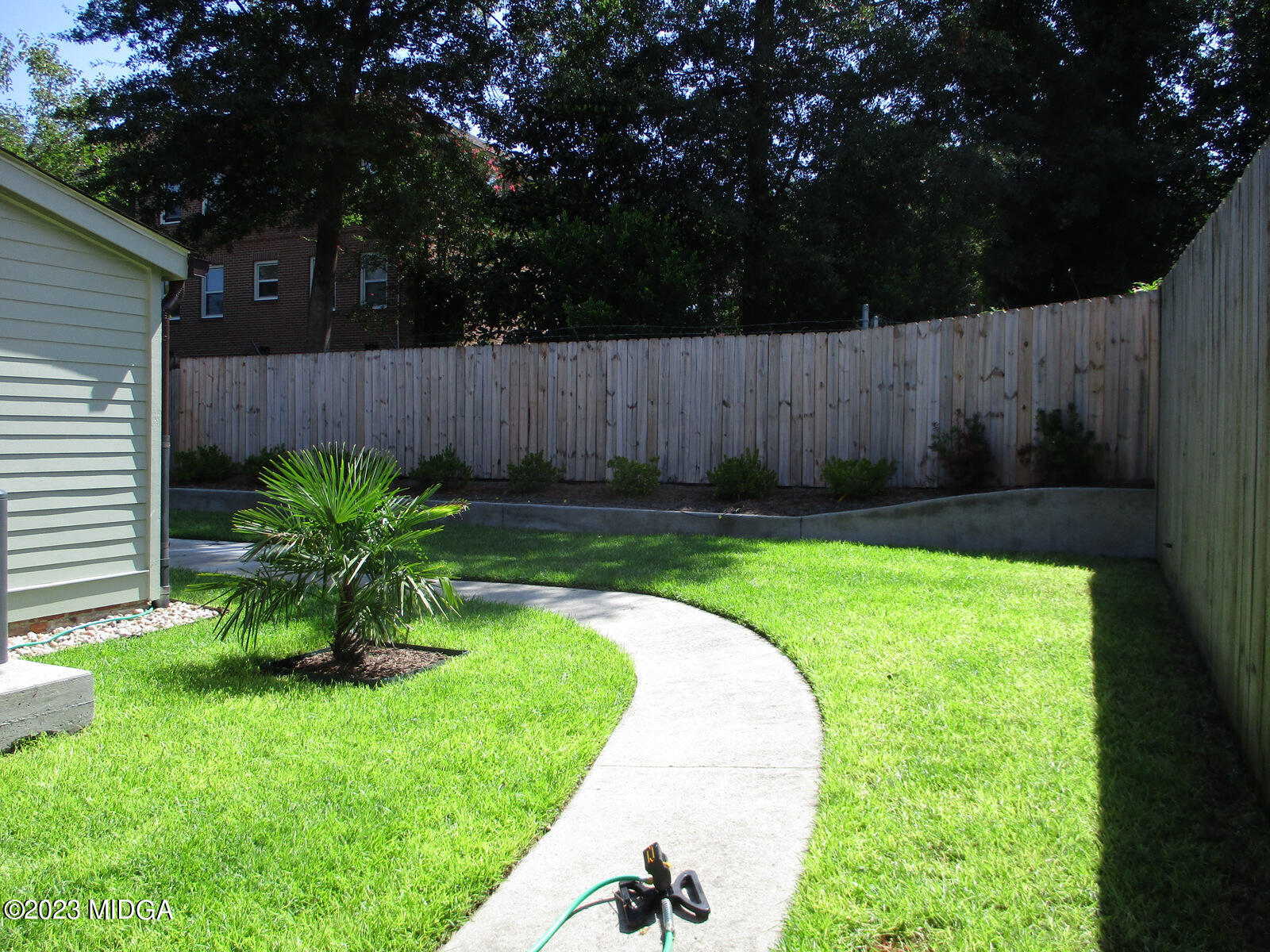 688 Monroe Street Macon, GA 31201 - Photo 11 of 26 a view of a backyard with a garden