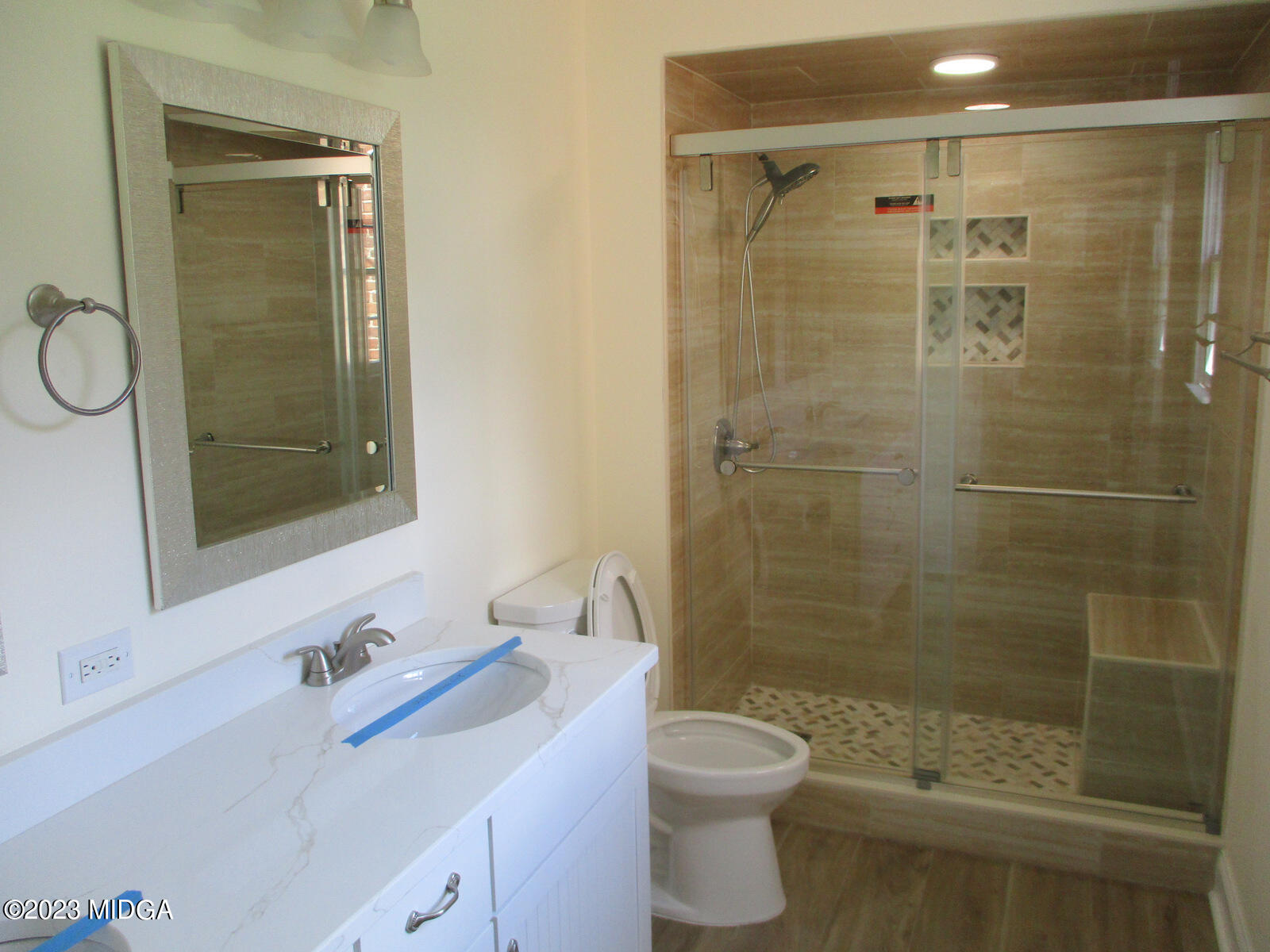 688 Monroe Street Macon, GA 31201 - Photo 14 of 26 a bathroom with a bathtub shower sink vanity and toilet