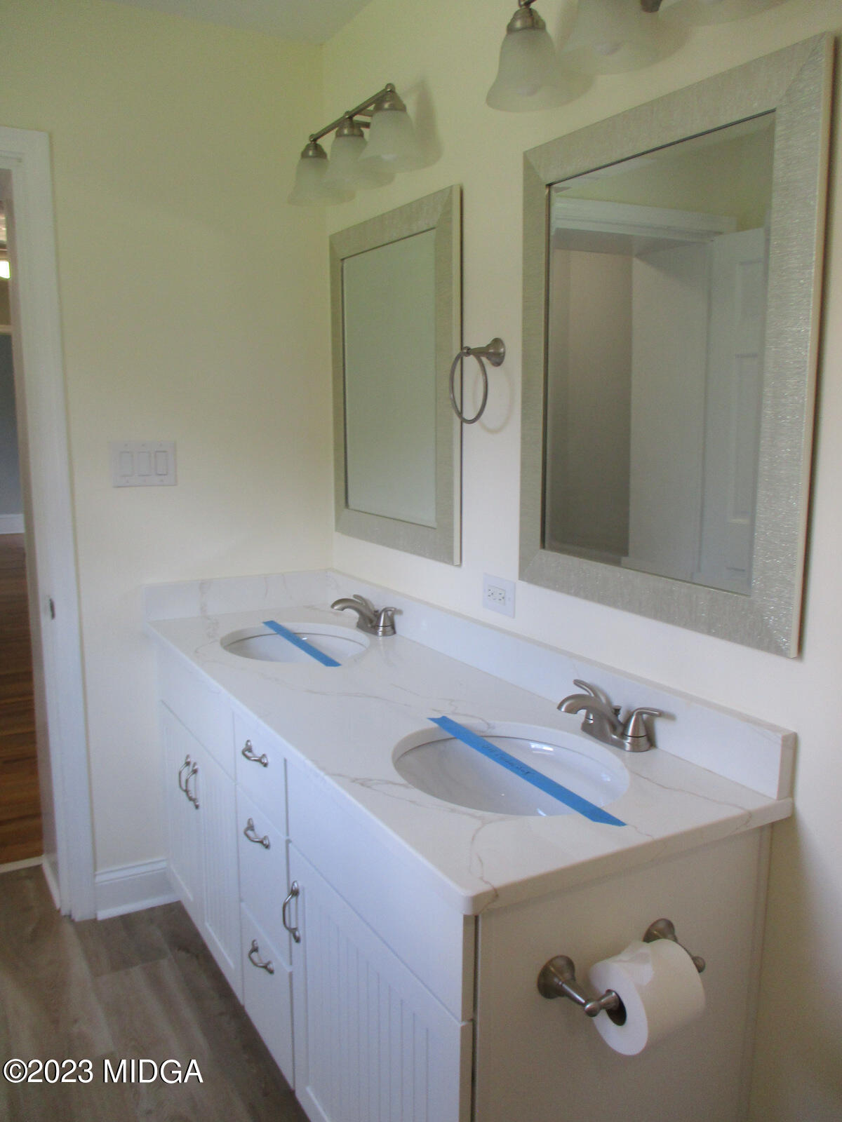 688 Monroe Street Macon, GA 31201 - Photo 15 of 26 a bathroom with a sink and a mirror