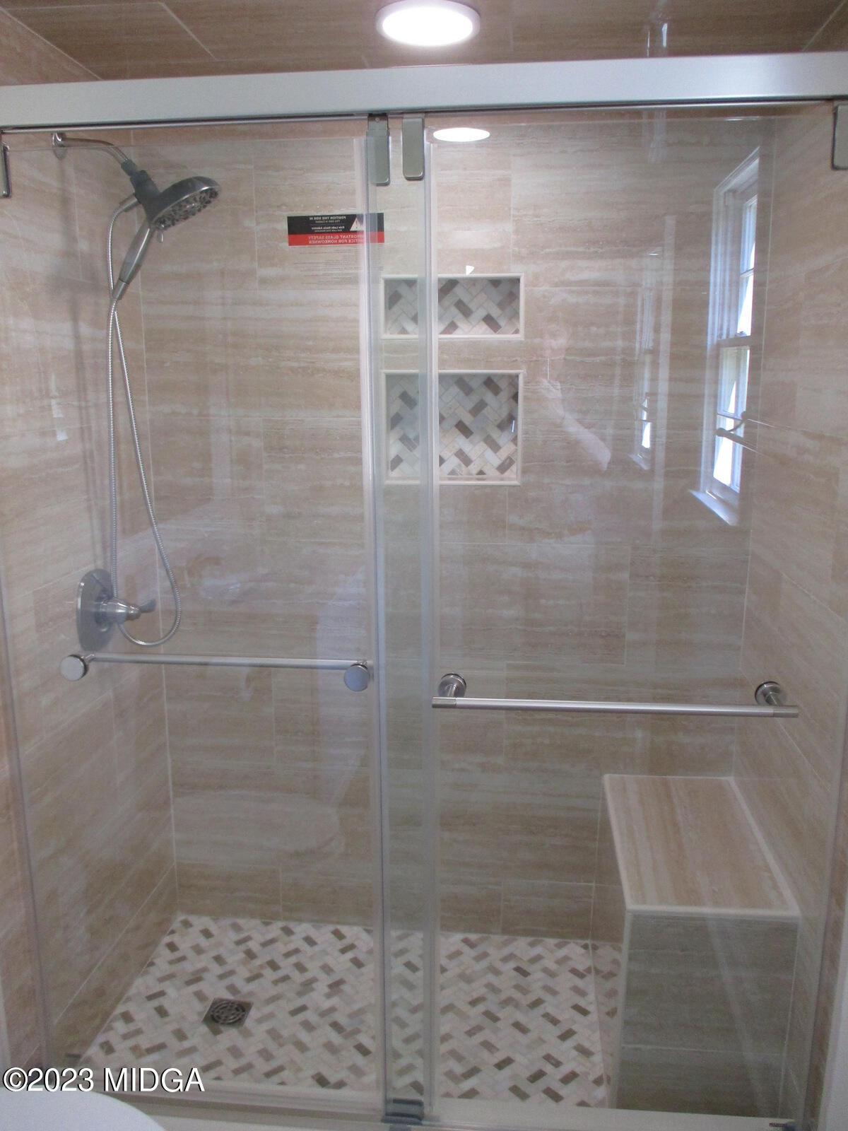 688 Monroe Street Macon, GA 31201 - Photo 16 of 26 a bathroom with a shower