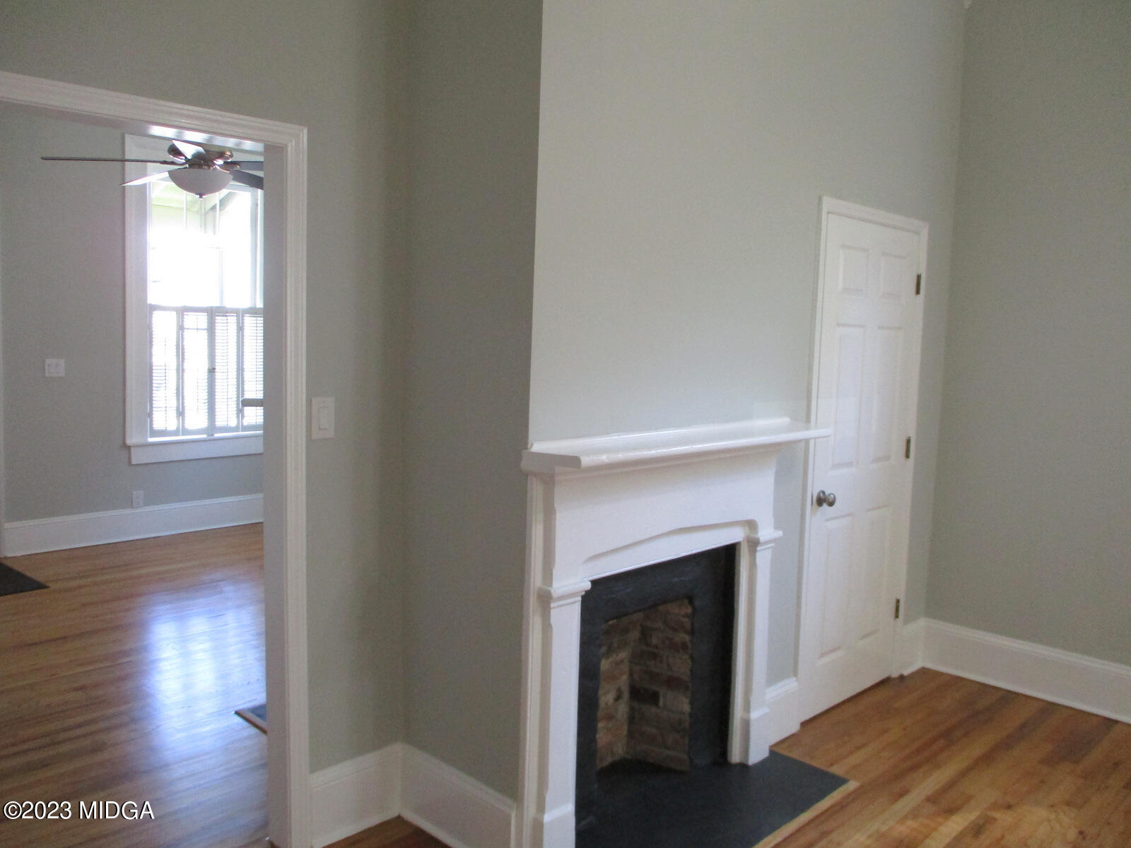 688 Monroe Street Macon, GA 31201 - Photo 19 of 26 a living room with a fireplace and wooden floor