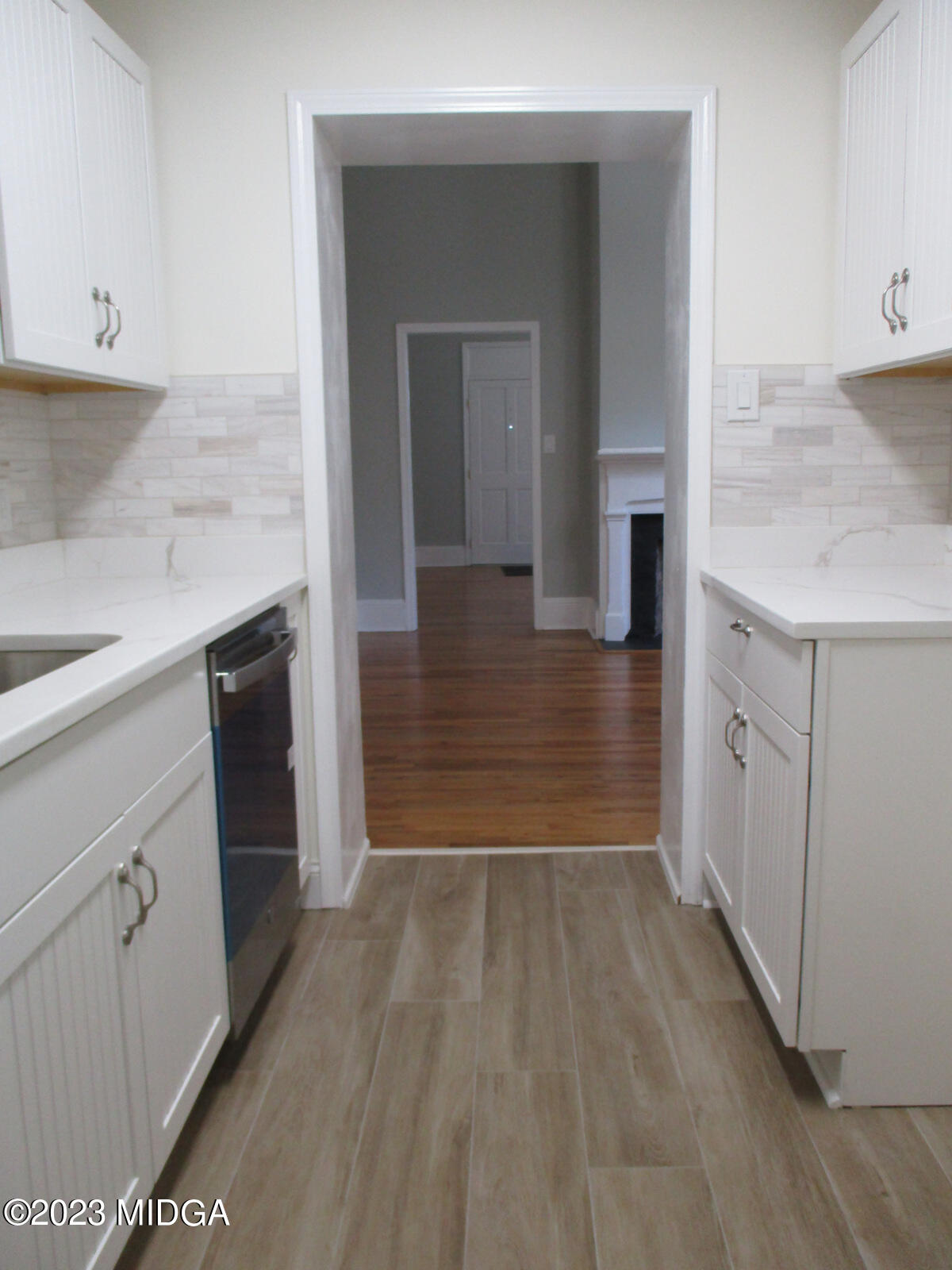 688 Monroe Street Macon, GA 31201 - Photo 20 of 26 a bathroom with a sink and mirror
