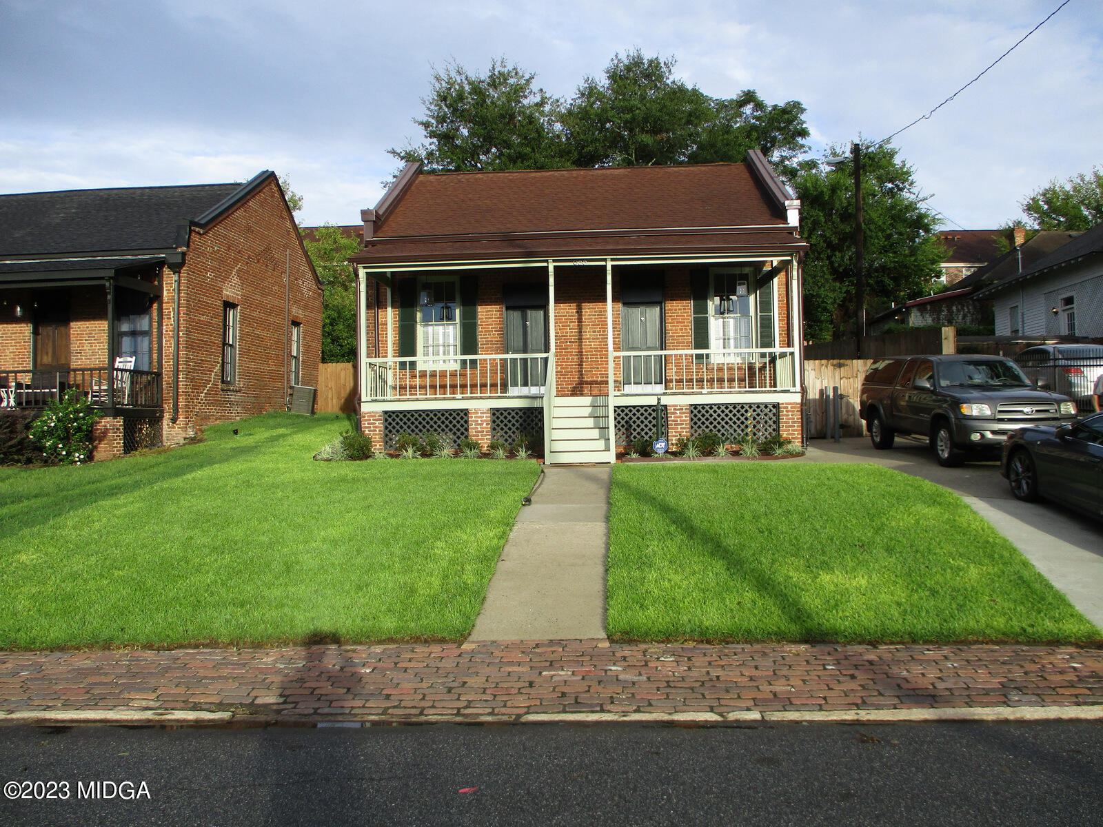 688 Monroe Street Macon, GA 31201 - Photo 25 of 26 a front view of a house with a garden and yard