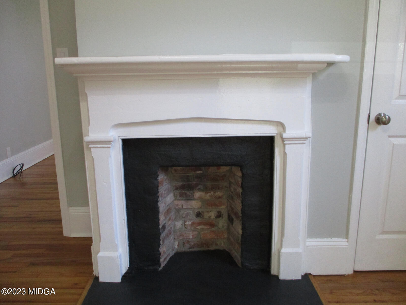 688 Monroe Street Macon, GA 31201 - Photo 8 of 26 a living room with a fireplace