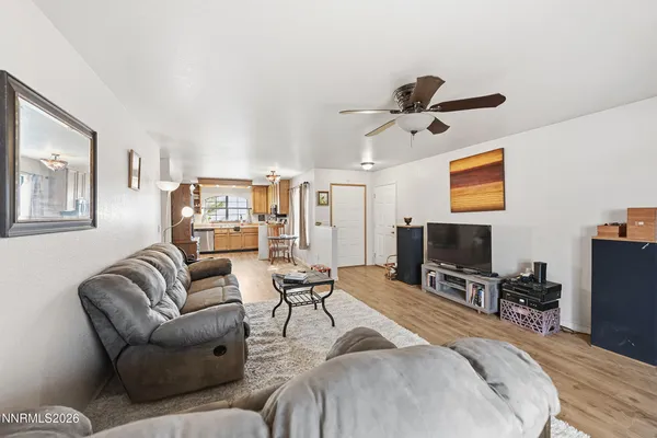 a bedroom with furniture and a flat screen tv