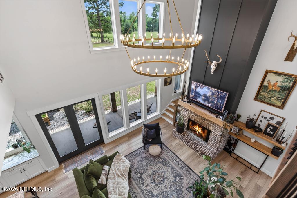 2955 Carroll Corner Road Hilliard, FL 32046 - Photo 69 of 106 a living room with furniture and a fireplace