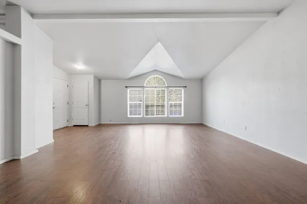 a white stove top oven sitting inside of a kitchen