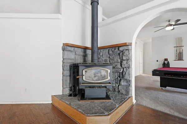a dining room with furniture a window and wooden floor
