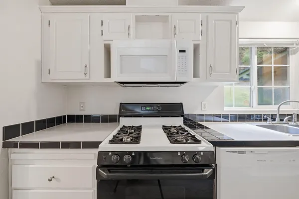 a room with pool table and windows