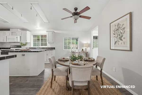 a room with pool table and stainless steel appliances
