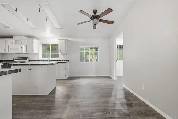 a bed room with a bed and a ceiling fan