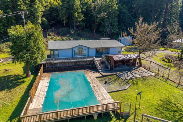 a view of a swimming pool with an outdoor space