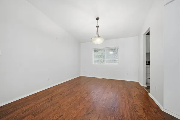 a bathroom with a sink a toilet and a large mirror
