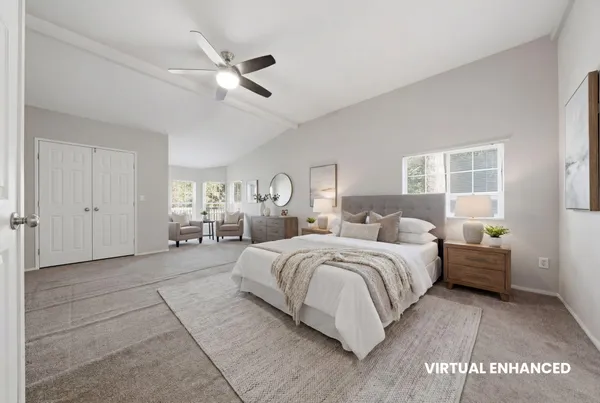 a bedroom with bed and window