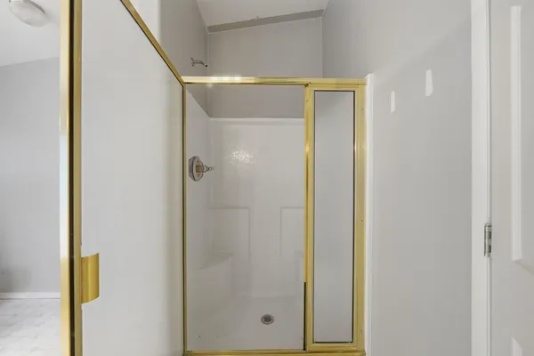 a view of a roof deck with wooden fence and a floor to ceiling window