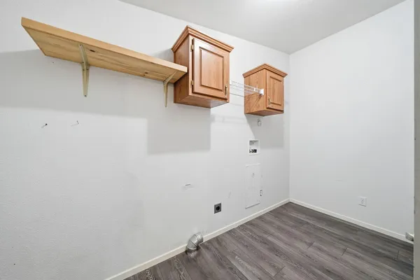 a view of a porch with furniture and a yard