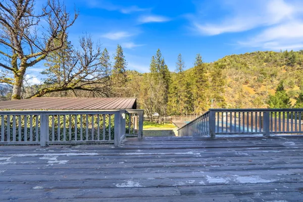 a view of a backyard with table and chairs