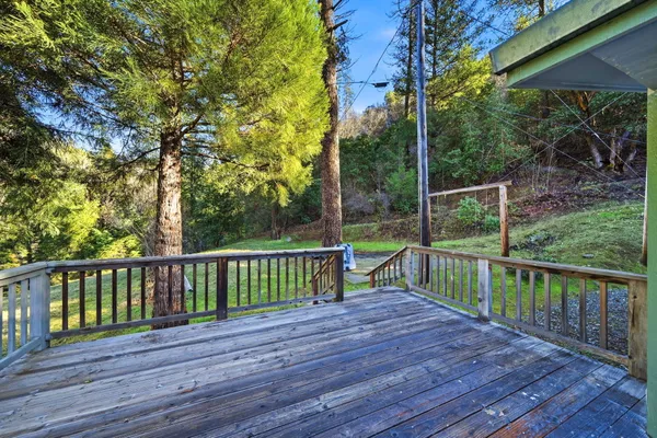 a view of a porch with chairs and floor