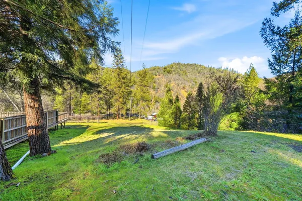 an aerial view of a house with a yard basket ball court and outdoor seating