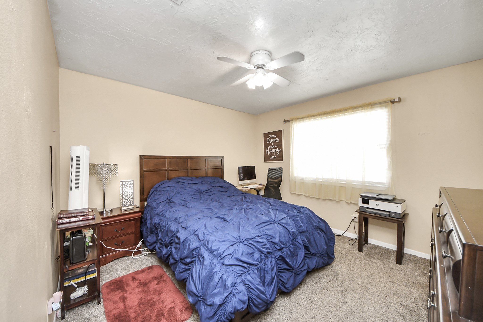 4155 Amir Street Houston, TX 77072 - Photo 32 of 43 a bedroom with a bed desk and a window