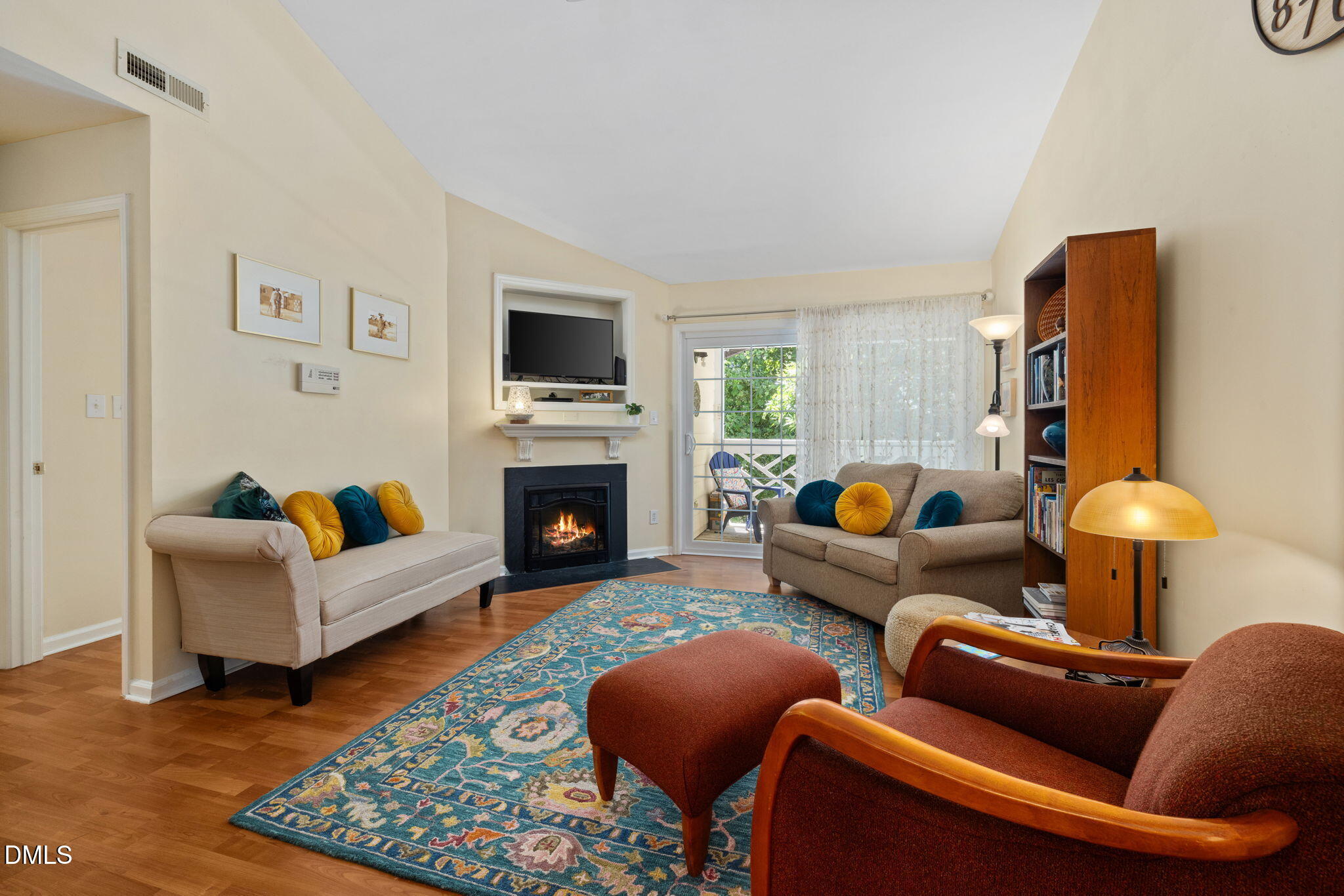 1003 Kingswood Drive, Unit N Chapel Hill, NC 27517 - Photo 2 of 23 a living room with furniture a rug and a fireplace