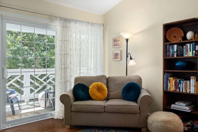 a living room with furniture or window and a book shelf