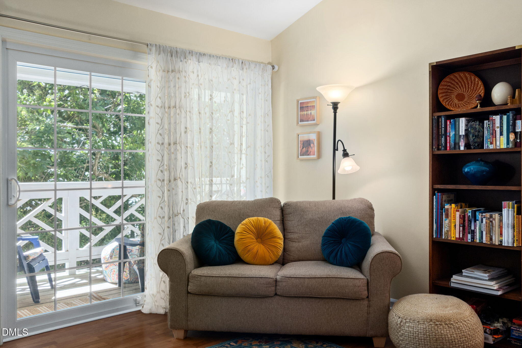 1003 Kingswood Drive, Unit N Chapel Hill, NC 27517 - Photo 6 of 23 a living room with furniture or window and a book shelf