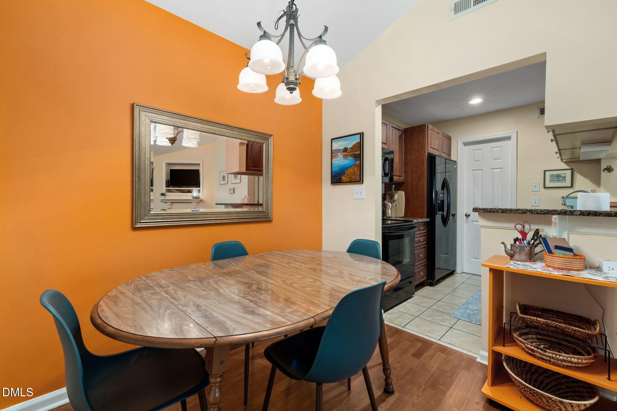 1003 Kingswood Drive, Unit N Chapel Hill, NC 27517 - Photo 8 of 23 a dining room with wooden floor and chandelier