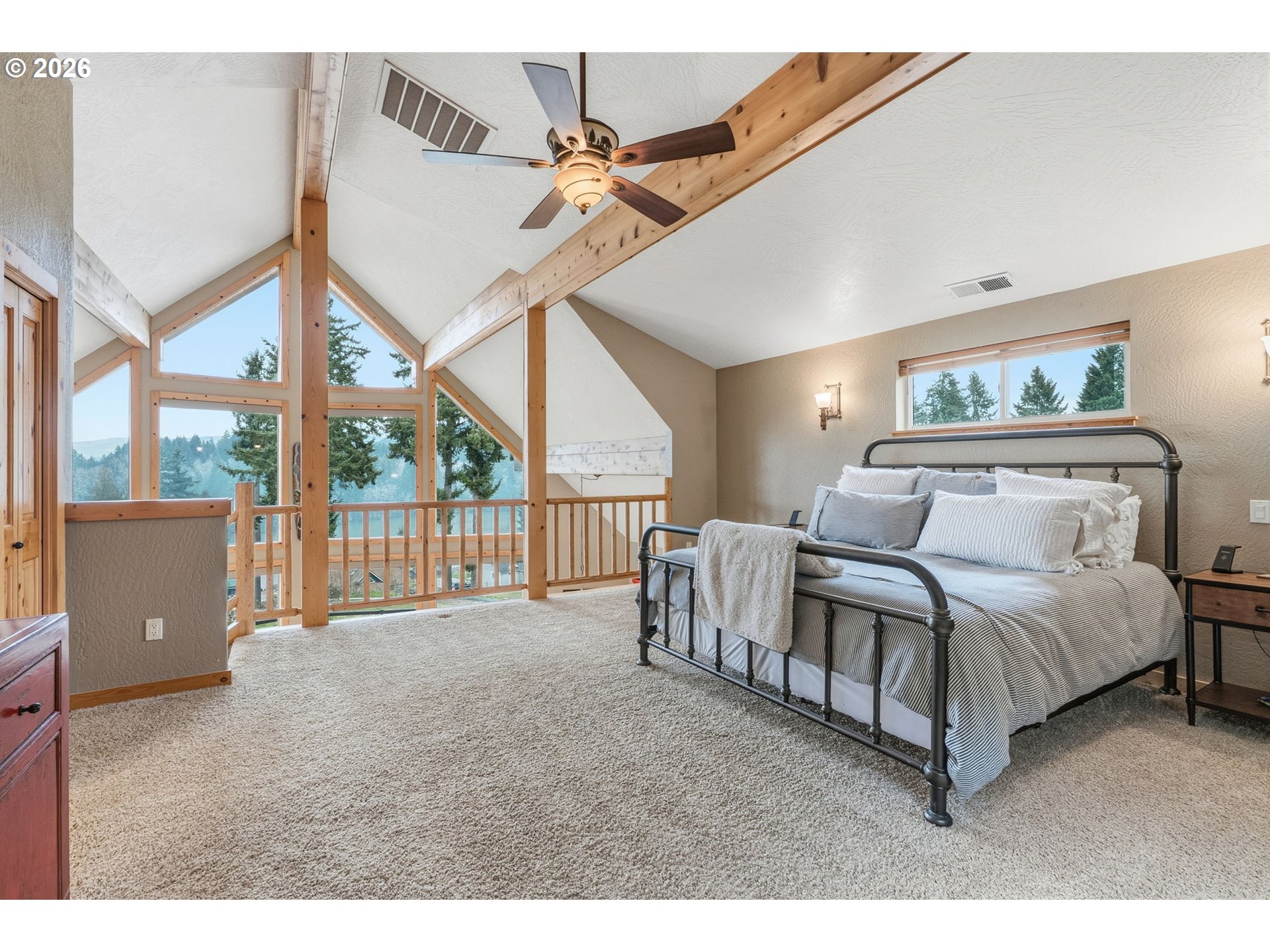 101 Lighthouse Lane Mossyrock, WA 98564 - Photo 12 of 37 a spacious bedroom with a bed and a large window