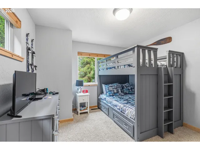 a bedroom with furniture and a window