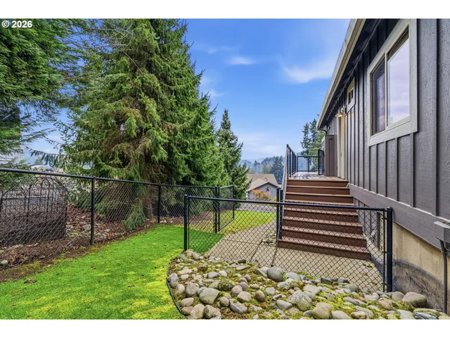 an aerial view of a house with a lake view