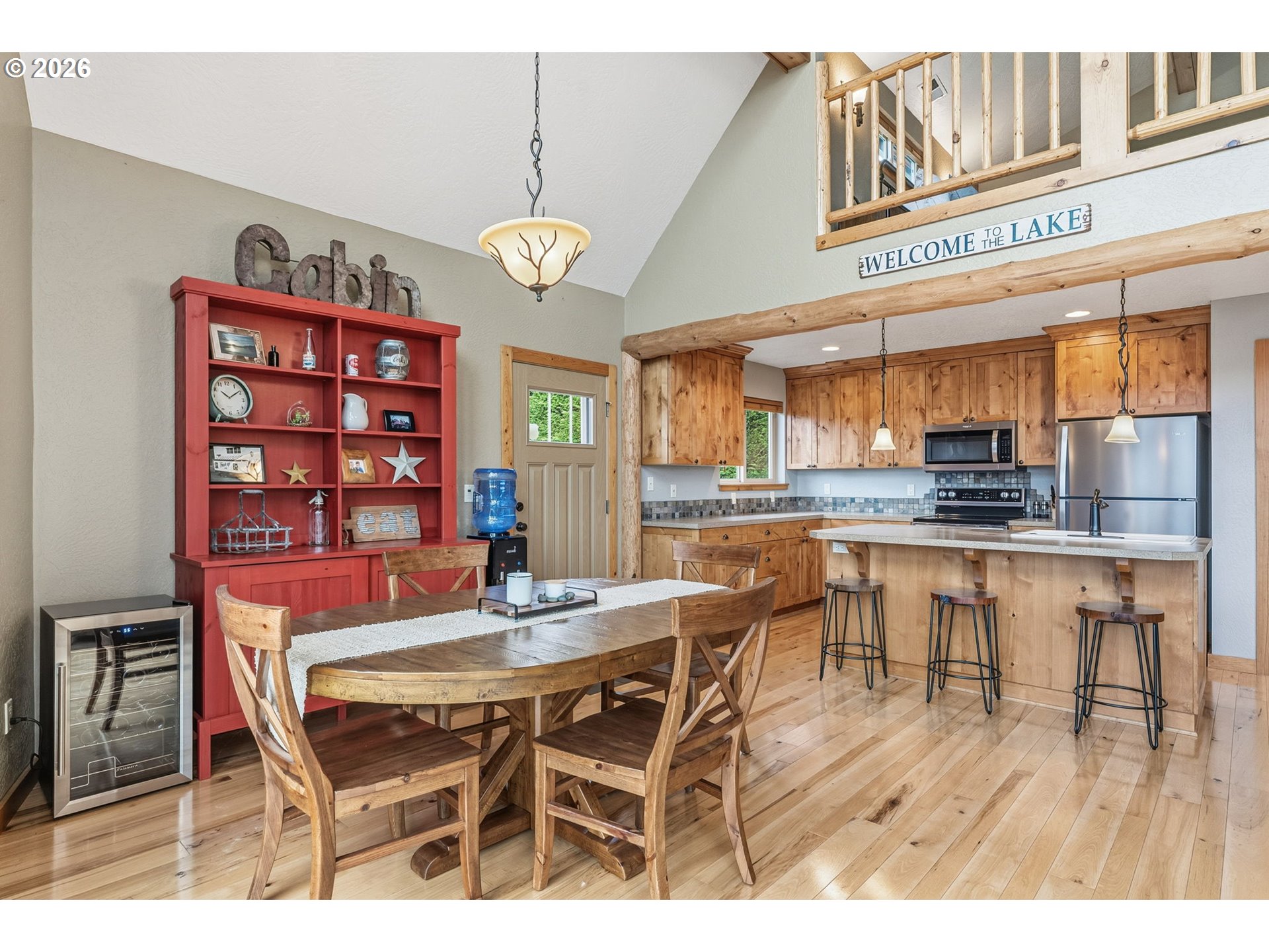 101 Lighthouse Lane Mossyrock, WA 98564 - Photo 8 of 37 a dining area with a table chairs and a kitchen view
