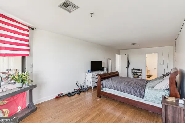 a bedroom with bed and window