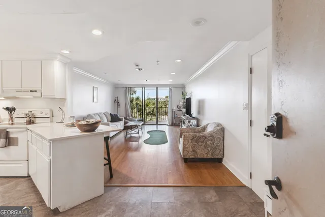 a view of kitchen with stainless steel appliances granite countertop lots of counter top space