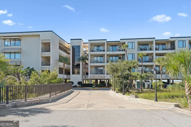 a view of a building with a yard