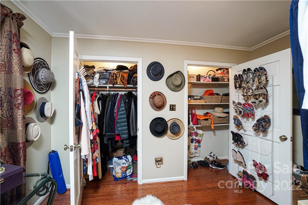 8032 Windjammer Drive Tega Cay, SC 29708 - Photo 18 of 48 a view of walk in closet with clothes and shoes
