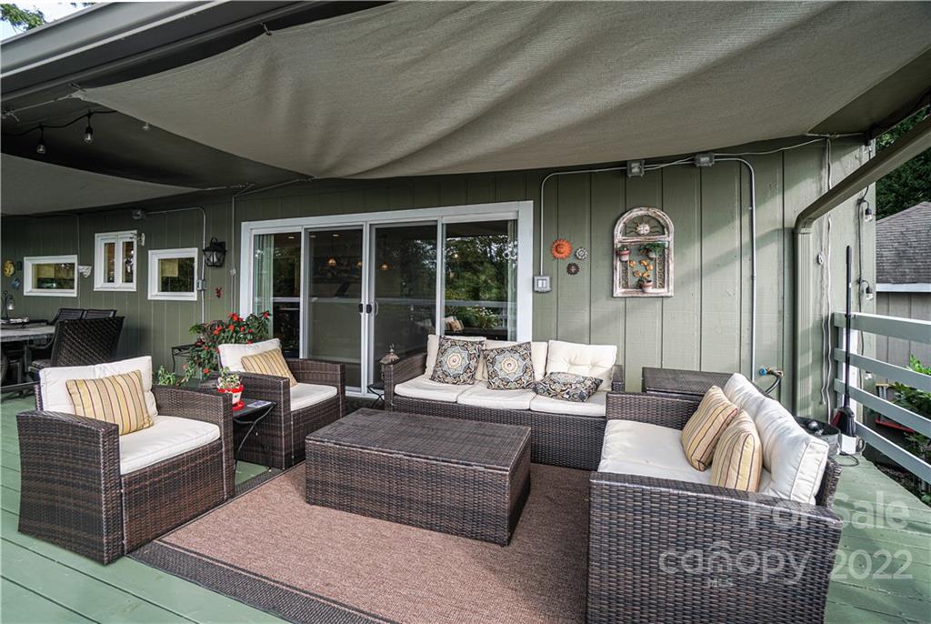 8032 Windjammer Drive Tega Cay, SC 29708 - Photo 21 of 48 a living room with furniture and a large window