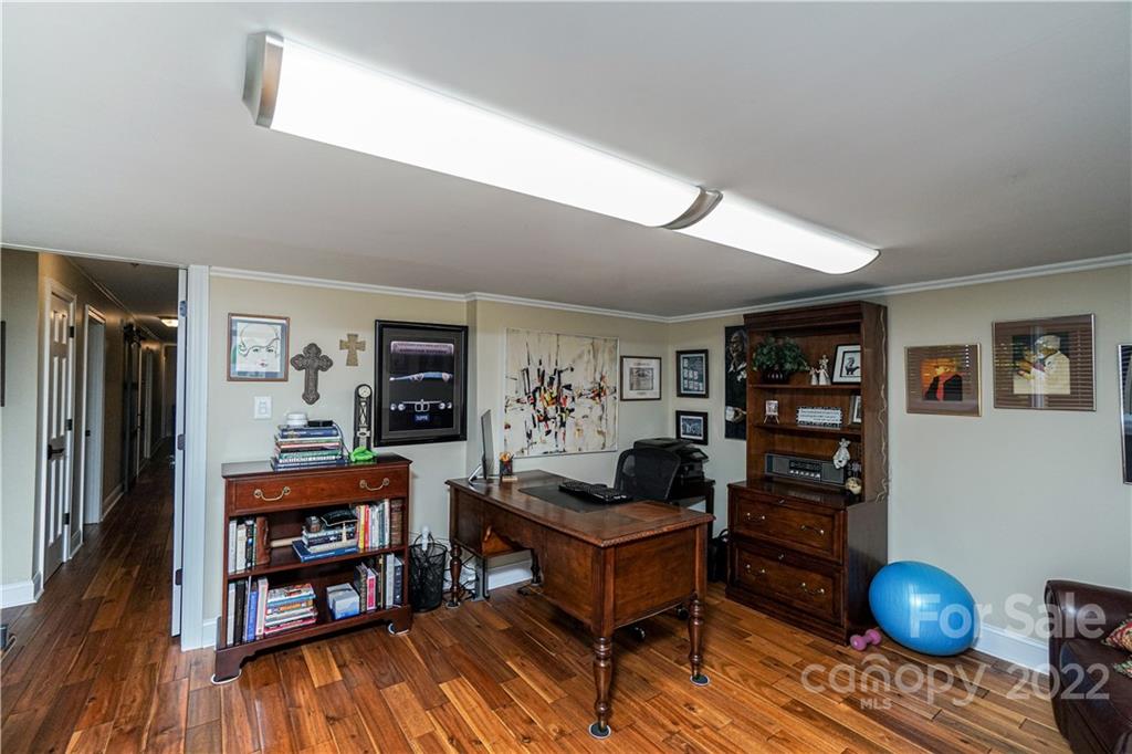 8032 Windjammer Drive Tega Cay, SC 29708 - Photo 30 of 48 a livingroom with workspace and a window
