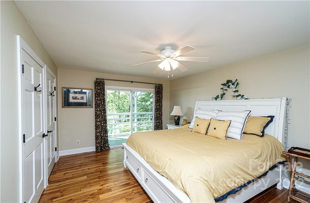 8032 Windjammer Drive Tega Cay, SC 29708 - Photo 33 of 48 a bedroom with a large bed and a window