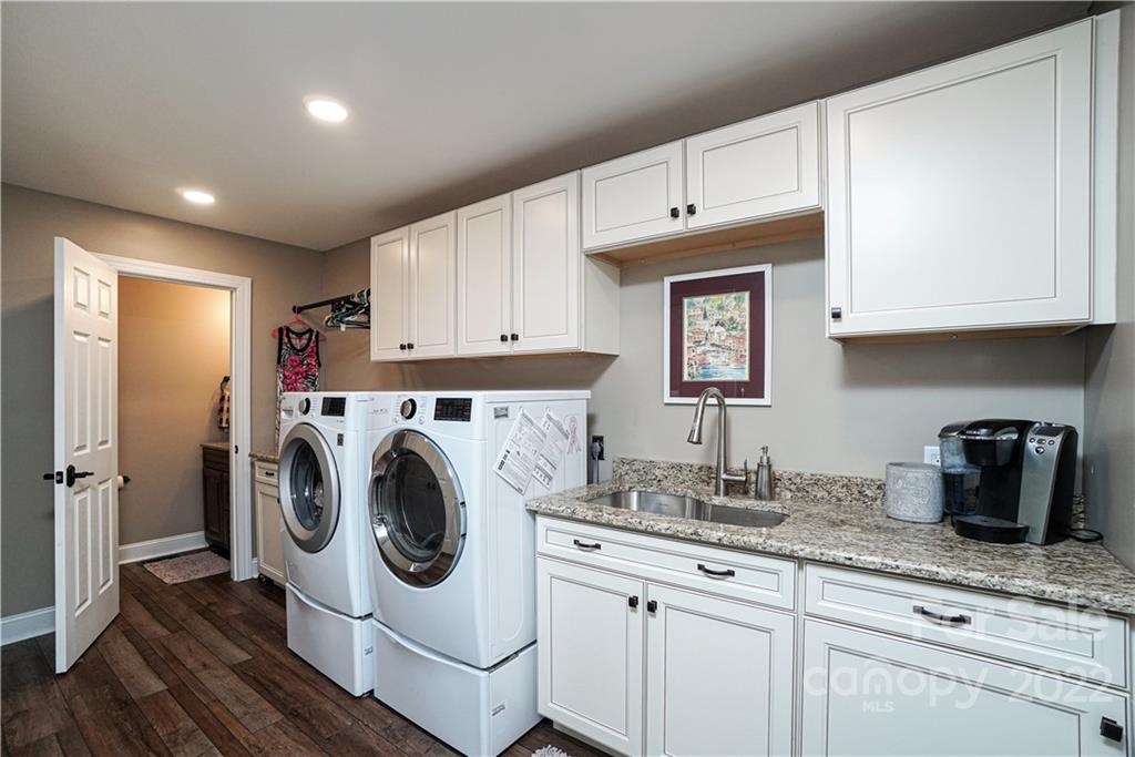 8032 Windjammer Drive Tega Cay, SC 29708 - Photo 35 of 48 a utility room with sink dryer and washer