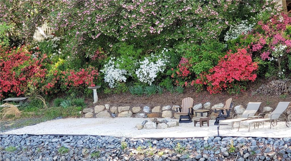 8032 Windjammer Drive Tega Cay, SC 29708 - Photo 41 of 48 a view of a backyard with sitting area and furniture