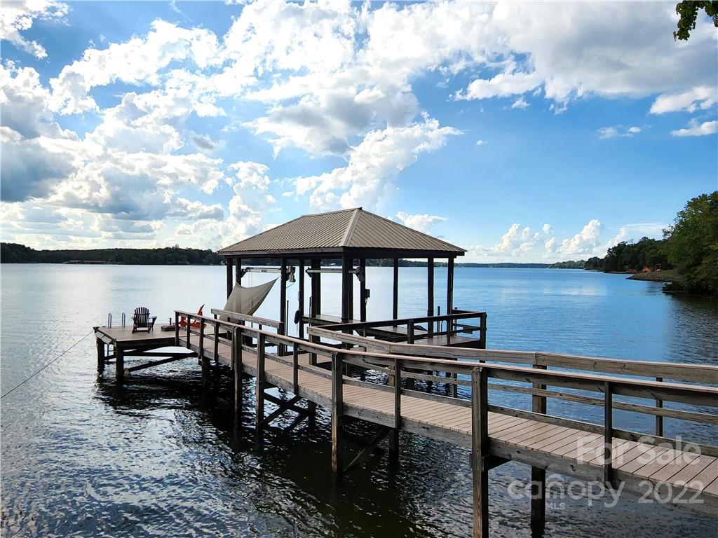 8032 Windjammer Drive Tega Cay, SC 29708 - Photo 42 of 48 a view of a chairs and table on the terrace