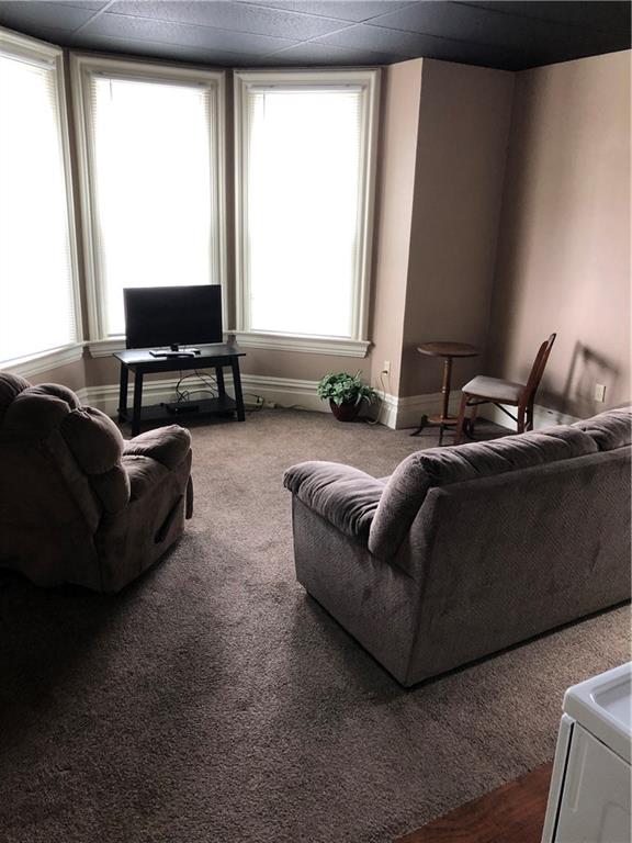 350 Jefferson Street Rochester, PA 15074 - Photo 3 of 19 a living room with furniture and a flat screen tv